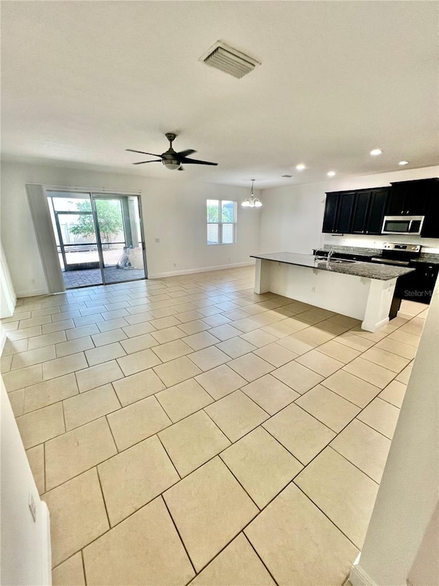 3333 Wauseon Dr, Saint Cloud, FL 34772 - unfurnished living room featuring recessed lighting, light tile patterned floors, baseboards, and a ceiling fan