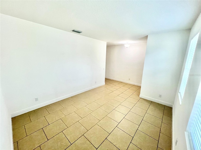 3333 Wauseon Dr, Saint Cloud, FL 34772 - spare room with light tile patterned floors and baseboards