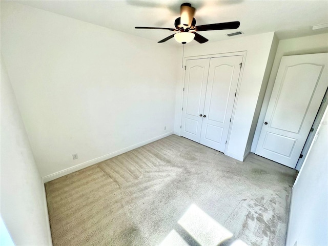 3333 Wauseon Dr, Saint Cloud, FL 34772 - unfurnished bedroom featuring carpet, baseboards, a closet, and ceiling fan
