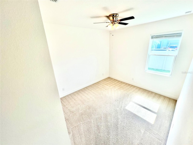3333 Wauseon Dr, Saint Cloud, FL 34772 - empty room featuring carpet floors, ceiling fan, and baseboards
