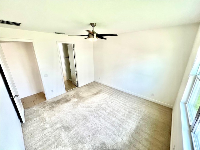 3333 Wauseon Dr, Saint Cloud, FL 34772 - unfurnished bedroom featuring carpet flooring, baseboards, ceiling fan, and tile patterned flooring