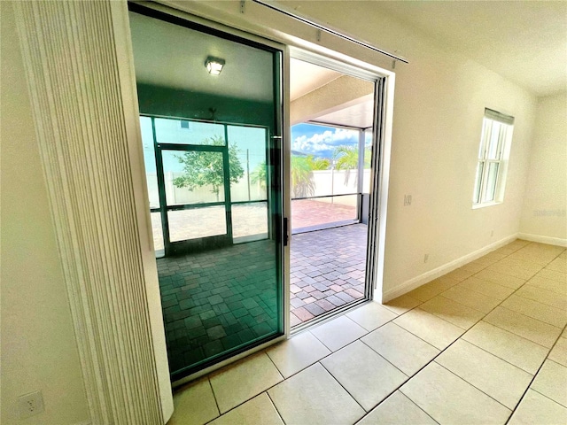 3333 Wauseon Dr, Saint Cloud, FL 34772 - doorway to outside featuring baseboards and light tile patterned floors