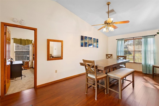 dining area with ceiling fan, dark wood-type flooring, and lofted ceiling