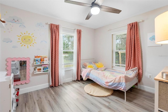 bedroom featuring ceiling fan and light hardwood / wood-style flooring