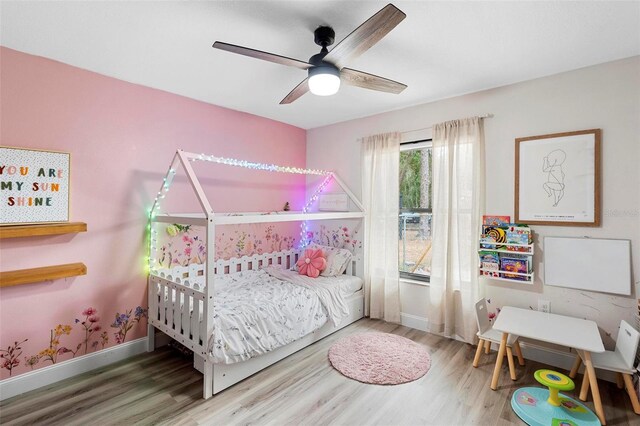 bedroom featuring wood-type flooring and ceiling fan