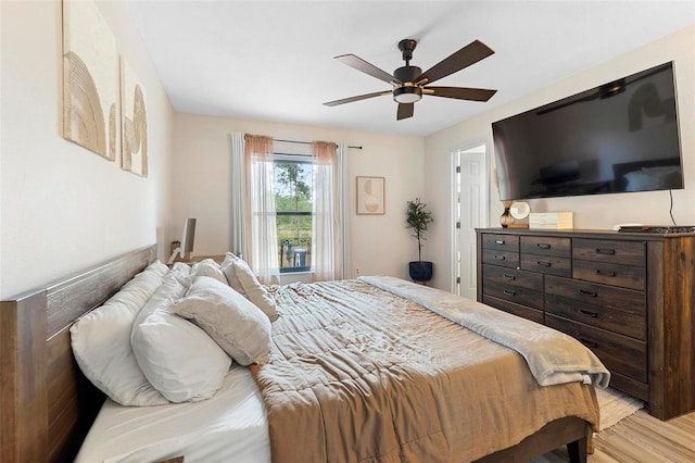 bedroom featuring ceiling fan and light hardwood / wood-style floors