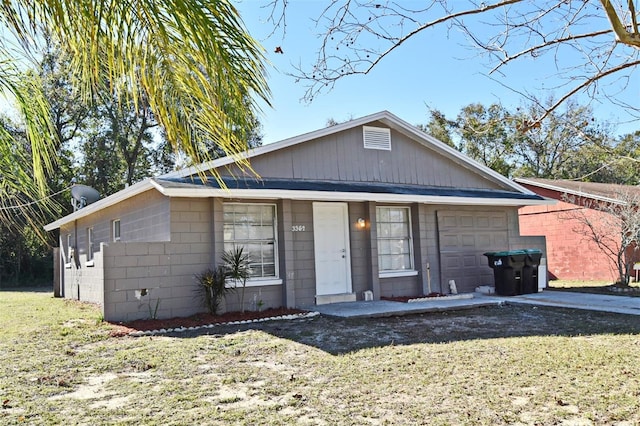 ranch-style house with a front lawn and a garage