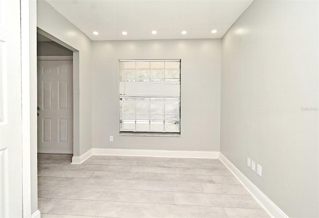 empty room with plenty of natural light and light wood-type flooring