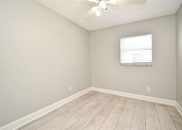 unfurnished room with ceiling fan