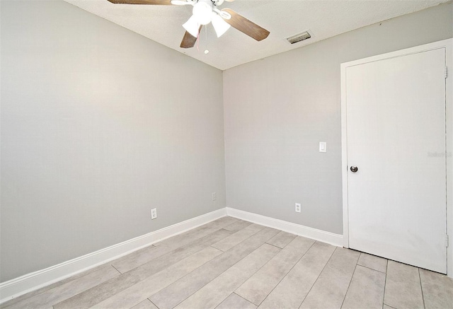 spare room with ceiling fan