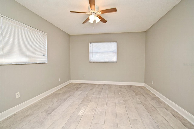 unfurnished room featuring ceiling fan and light hardwood / wood-style floors