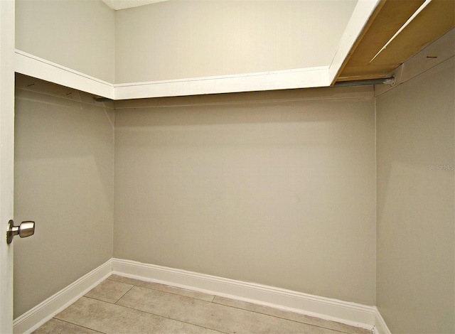 spacious closet featuring tile patterned floors