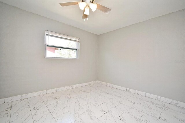 spare room featuring ceiling fan