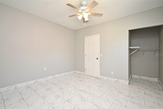 unfurnished bedroom featuring ceiling fan and a closet