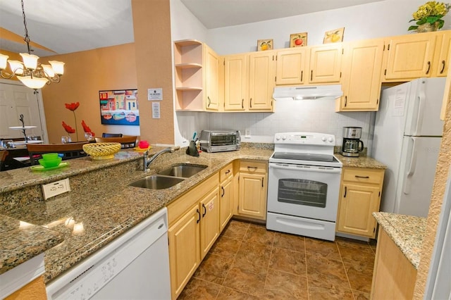 kitchen featuring light brown cabinetry, sink, white appliances, and an inviting chandelier