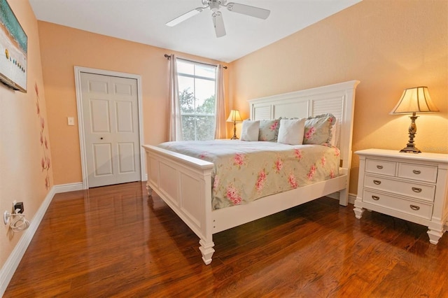 bedroom with ceiling fan and dark wood-type flooring