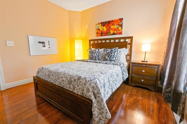 bedroom featuring dark hardwood / wood-style floors