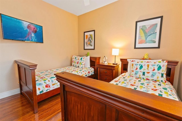 bedroom featuring hardwood / wood-style floors and ceiling fan