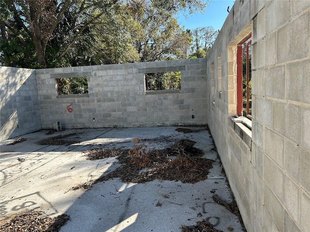 view of side of property featuring a patio area