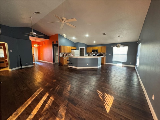 unfurnished living room with dark hardwood / wood-style flooring and lofted ceiling