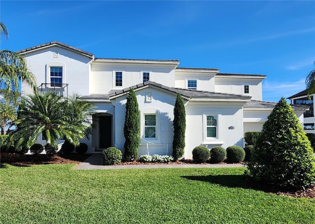 view of front facade with a garage and a front lawn