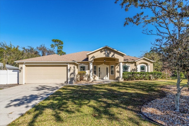 view of front of home with a garage and a front yard