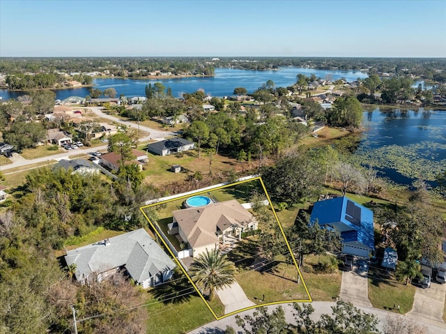 birds eye view of property with a water view