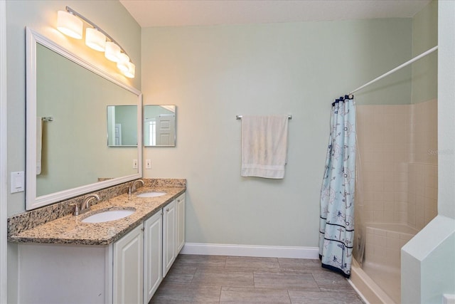 bathroom with vanity and a shower with shower curtain