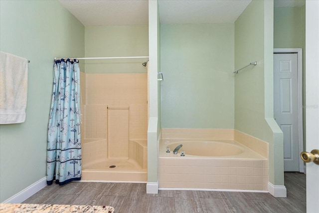 bathroom with hardwood / wood-style flooring and plus walk in shower