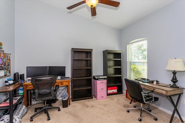 home office with ceiling fan, light carpet, and vaulted ceiling