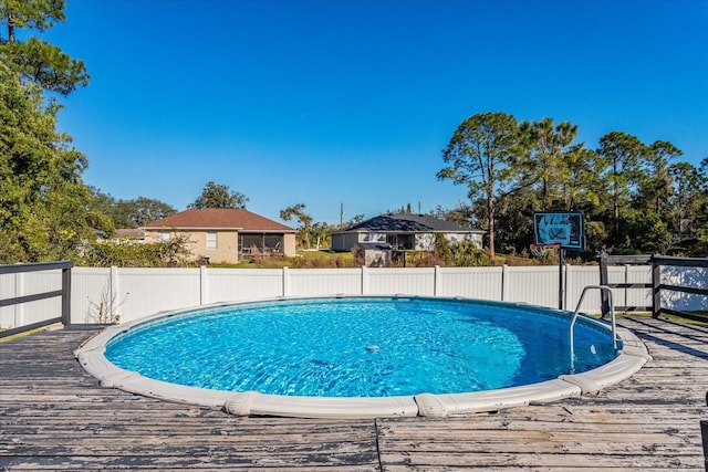 view of pool with a wooden deck