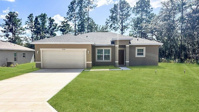 view of front of home with a garage and a front lawn