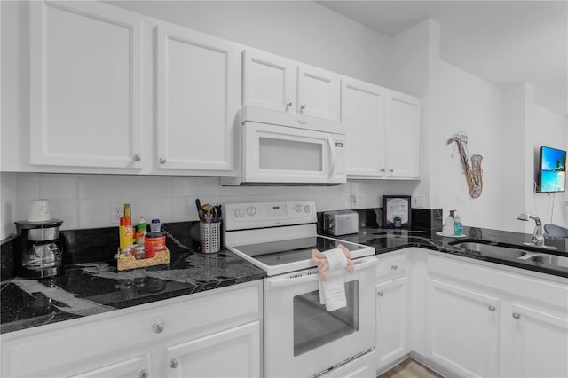 kitchen featuring white appliances, white cabinetry, and sink