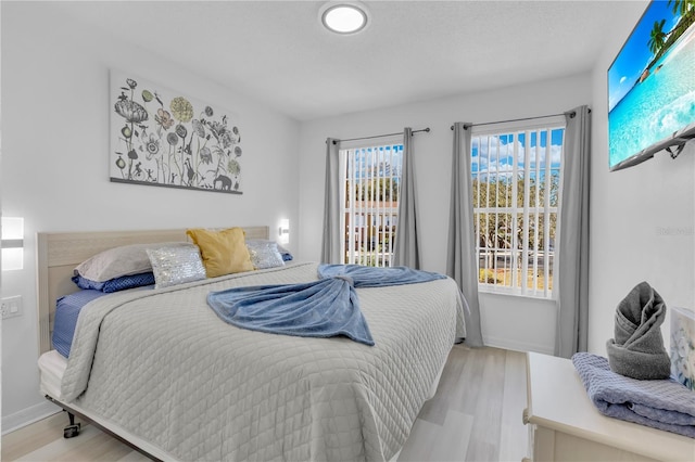 bedroom with light hardwood / wood-style floors