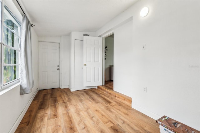 spare room featuring light wood-type flooring