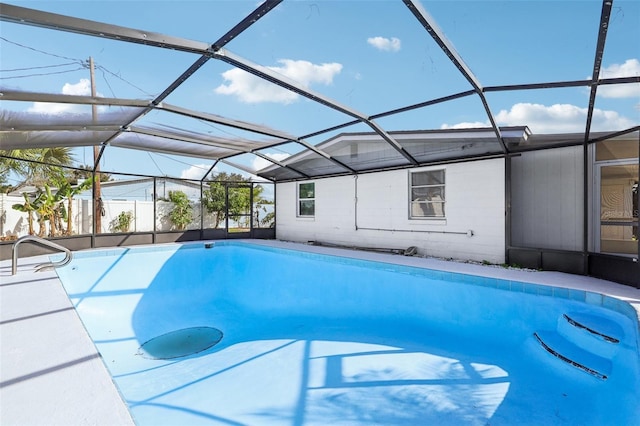 view of pool with a lanai