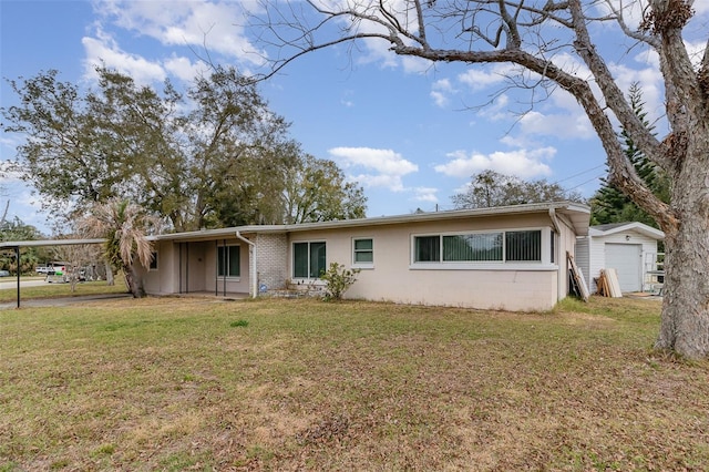 ranch-style house with a garage and a front lawn