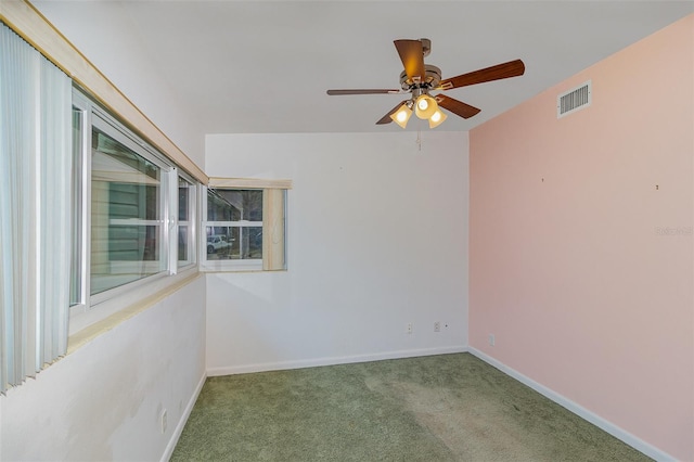 carpeted empty room featuring ceiling fan