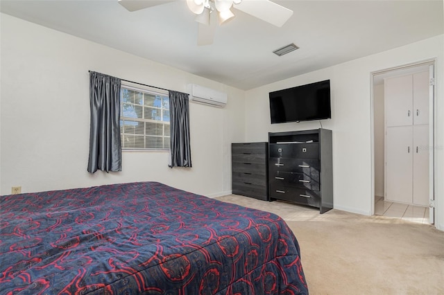 carpeted bedroom featuring an AC wall unit and ceiling fan