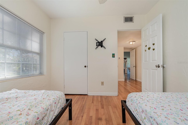 bedroom with light hardwood / wood-style flooring