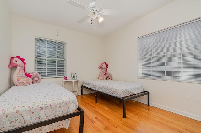 bedroom featuring ceiling fan and hardwood / wood-style floors