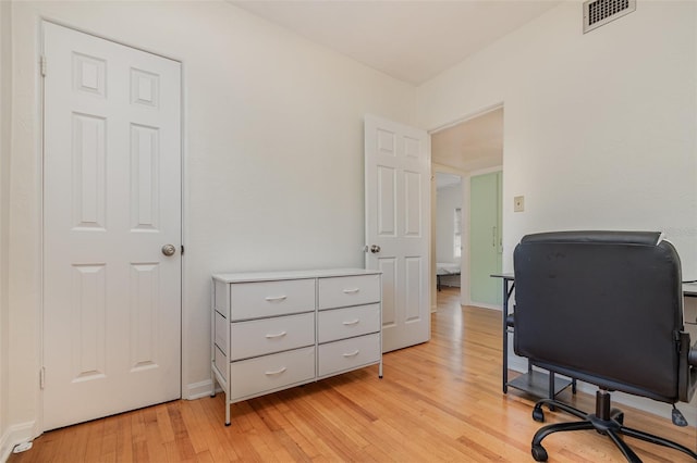 office space with light hardwood / wood-style flooring