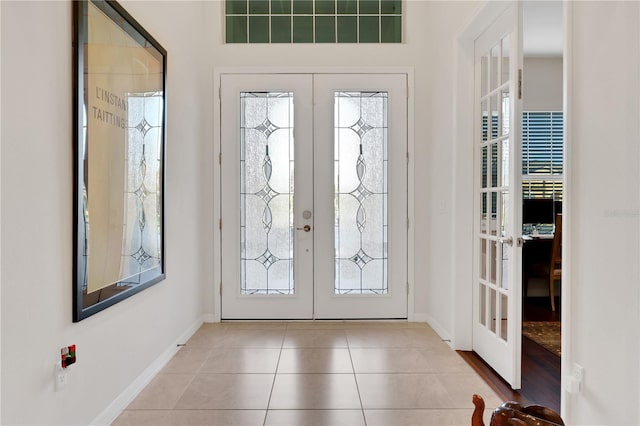 tiled entrance foyer with french doors