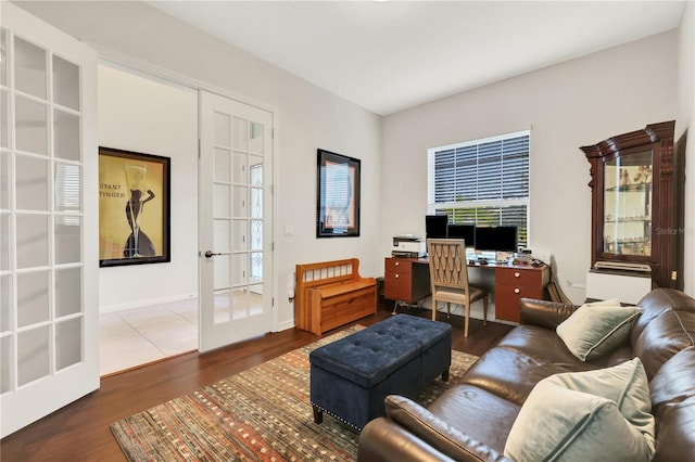 living room featuring wood-type flooring and french doors