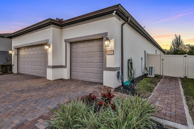 property exterior at dusk with a garage