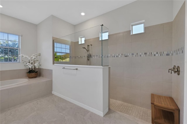 bathroom with tile patterned flooring and independent shower and bath