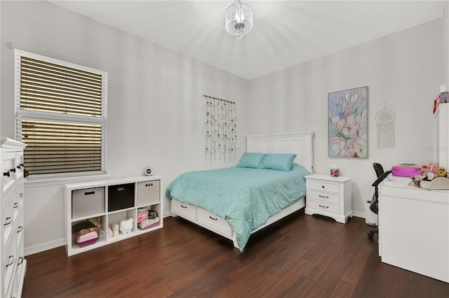 bedroom with dark hardwood / wood-style flooring