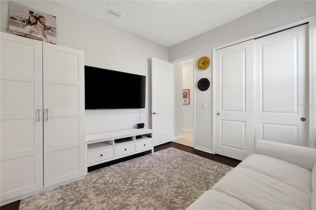 living room with dark hardwood / wood-style flooring