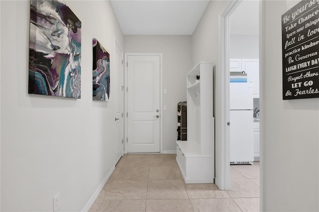 hallway featuring light tile patterned floors