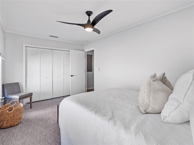 carpeted bedroom featuring ceiling fan and a closet